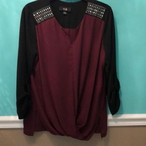 Black/wine blouse with embellished shoulders.